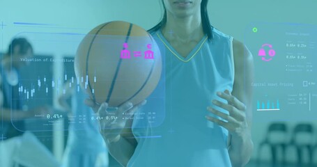 Female athlete shifting basketball grip showing sports analytics HUD as teammates reviewing tablet - Powered by Adobe