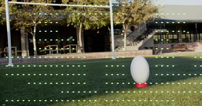After pause turf gaining dot grid around ball for tracking while camera tilting revealing building