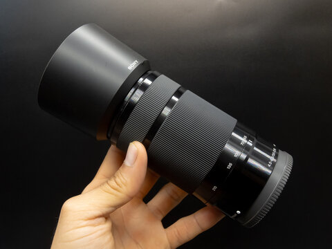 Zapopan Jalisco, Mexico - September 22, 2025: Sony telephoto zoom lens with lens hood, camera lens concept