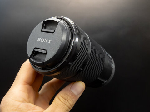 Zapopan Jalisco, Mexico - September 22, 2025: Sony telephoto zoom lens with lens hood, camera lens concept