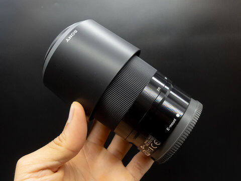 Zapopan Jalisco, Mexico - September 22, 2025: Sony telephoto zoom lens with lens hood, camera lens concept