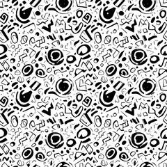 Whimsical doodle pattern in black and white featuring abstract shapes and hand drawn elements