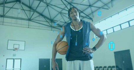 Athlete holding basketball while camera zooming in, revealing binary code visualizing sports data - Powered by Adobe