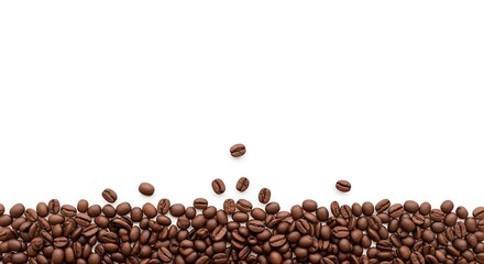 A pile of aromatic roasted coffee beans isolated on a clean white background forming a bottom border with copy space for text