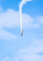 Air show planes flying in formation in blue sky