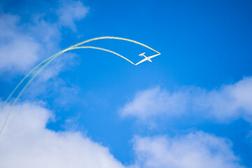 Air show planes flying in formation in blue sky