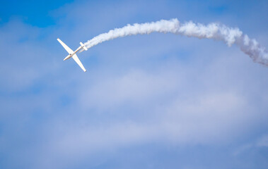 Air show planes flying in formation in blue sky