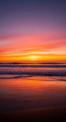 Fototapeta premium A breathtaking coastal sunset, showcasing vibrant hues of orange, pink, and purple across a serene ocean.