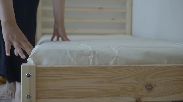 Setting up a new bed frame with a mattress