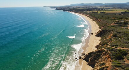 Spectacular aerial view showcasing a pristine beach landscape meeting the blue ocean and greenery