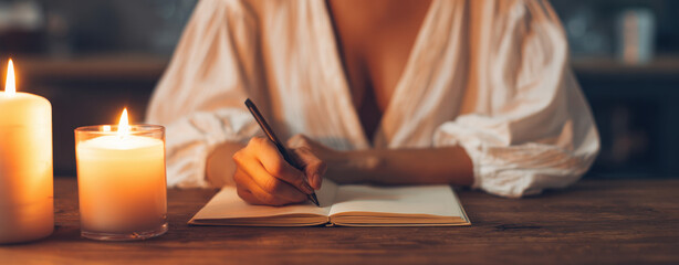 Christmas Digital Detox, embracing calm moments of handwriting by candlelight, slowing down for personal reflection and peaceful clarity.