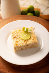 Carlota de Limon, a cold, no-bake dessert made with layers of Maria cookies and a creamy mixture of lemon and condensed milk, an easy homemade recipe very popular in Mexico.