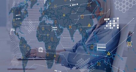 Mid adult woman opening laptop, typing at desk for global data analysis while map overlays evolving - Powered by Adobe