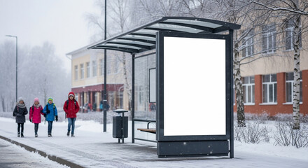 Children walking past winter bus stop with blank advertisement