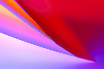 Colorful abstract curves in shades of red, pink and violet creating a dynamic visual experience