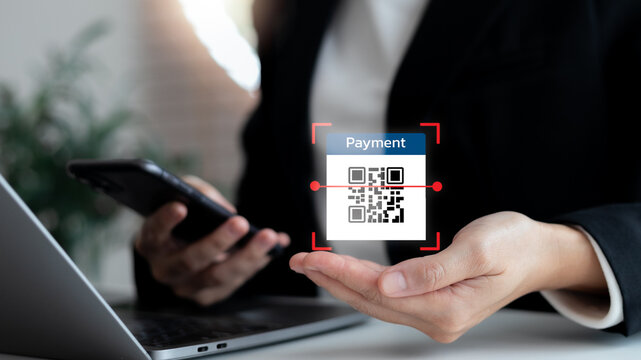 Businessman scanning QR code payment with smartphone, digital wallet technology, online banking, secure transaction, cashless society, fintech innovation, mobile finance, and e-commerce solution.