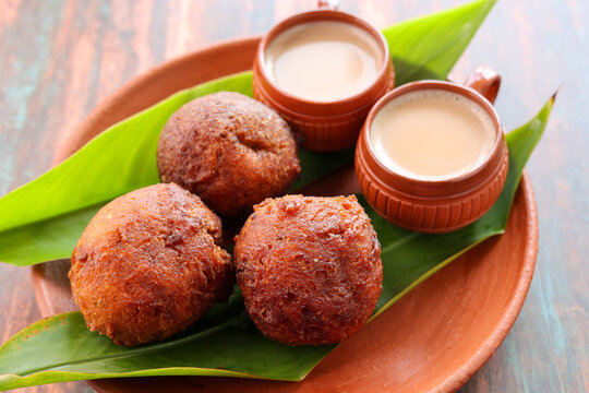 Indian snack Kerala food bonda made from wheat flour  and milk tea undampori 