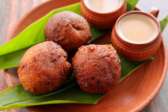 Indian snack Kerala food bonda made from wheat flour  and milk tea undampori 