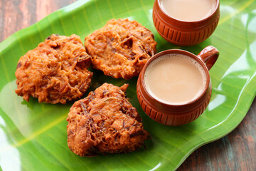 Ulli vada spicy onion fritters popular South Indian deep fried tea time snack with onion Kerala India . Indian . Traditional Indian food for Ramadan Ramzan. Kerala snack.