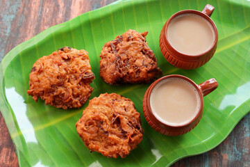 Ulli vada spicy onion fritters popular South Indian deep fried tea time snack with onion Kerala India . Indian . Traditional Indian food for Ramadan Ramzan. Kerala snack.