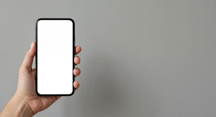 Smart Phone with Blank Display: A hand confidently holds a sleek, modern smartphone with a pristine, blank display, perfectly positioned to showcase content, applications.
