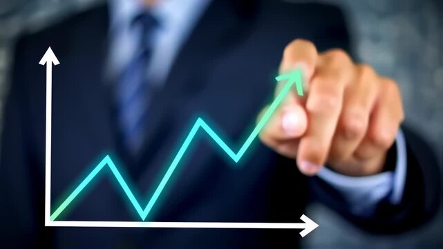 Business person pointing at a glowing graph of upward trend