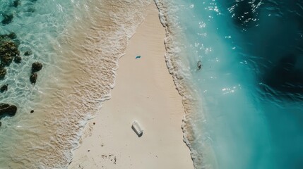 Serene Beachscape: An Aerial View of Pristine Sand and Turquoise Waters