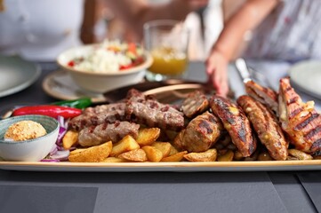 Closeup of traditional minced meat dish with vegetables on the table