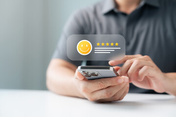 Customer satisfaction review and rating concept on smartphone with five star feedback. User giving positive evaluation through digital for online reputation, service quality, business success.