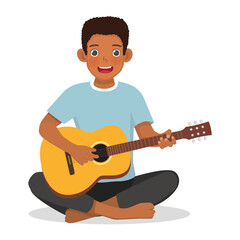 African man playing guitar sitting on the floor
