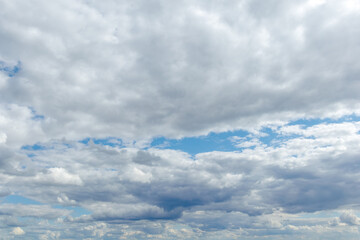 Blue sky with dramatic white clouds