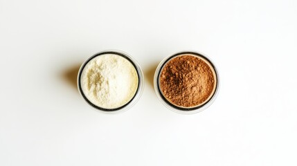Fototapeta premium Fine White and Brown Powders in Glass Containers on White Surface