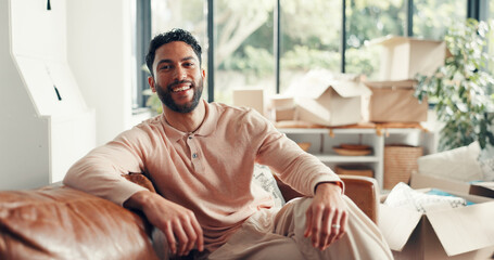 Portrait, sofa and happy man in new home for moving in, real estate investment or property ownership. Landlord, smile and person in dream house for relocation, mortgage and homeowner in living room
