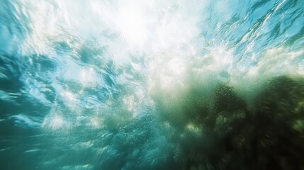 Underwater View of Sunlight Reflections and Bubbles in Ocean Water