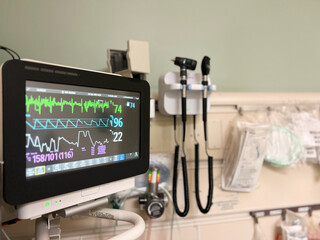 Blood pressure monitor, medical monitoring equipment in a hospital room representing health care, emergency departments and medicine. 