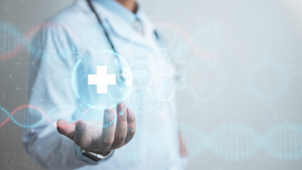 Doctor presenting healthcare technology with medical cross hologram, symbolizing innovation, digital health, treatment, prevention, and modern medical care.