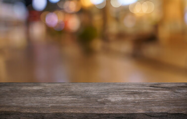Empty wood table top and blur of restaurant background selective focus product display