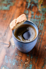 Cup of coffee on rustic wooden background. Soft focus. Copy space	