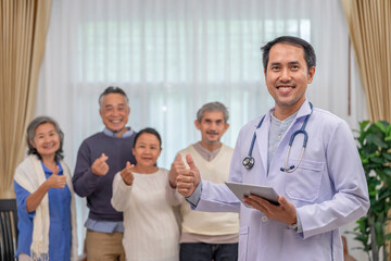 portrait a doctor or psychologist in uniform with stethoscope holding tablet computer,standing in counselling room,background blurred elderly group therapy