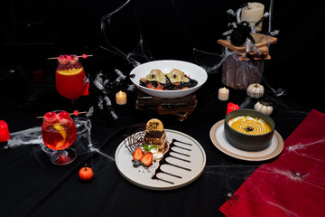 Spooky Culinary Spread: A delicious and creative arrangement of Halloween-themed dishes and cocktails, presented in a festive and artistic setup that ignites a sense of excitement and delight.