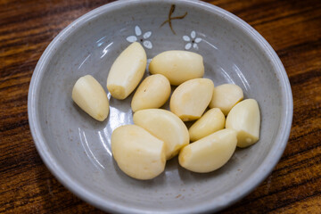 fresh garlics on the ceramic dish