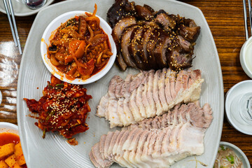 jokbal and bossam with spicy side dishes