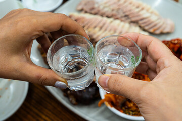two cups of soju on the pork cuisine