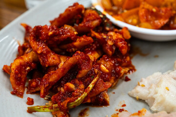 spicy radish kimchi served with bossam. 