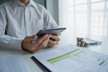 Accountant planning finances on tablet