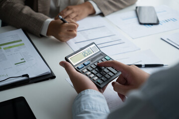Businessmen and women are having a meeting to plan finance and investment