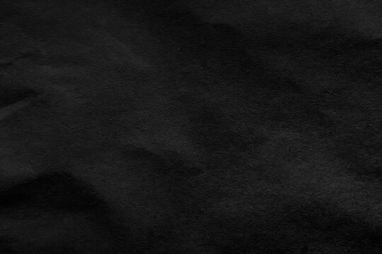 True black shade tone color paint on creased blank recycling eco environmental friendly paper texture background with space minimal style 