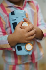 toy in hands of a todler