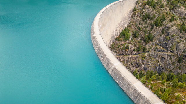 Aerial panoramic view of Emosson Dam and Lake in the Swiss Alps, renewable hydropower reservoir and mountain landscape, sustainable clean energy infrastructure