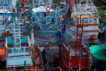 Colorful Fishing Boats Moored in Vibrant Harbor Scene